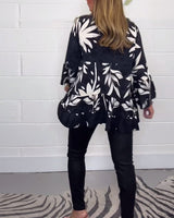 Blouse imprimée à manches cloche et boutons