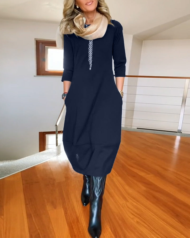 Robe élégante de couleur unie avec poche et col rond