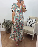Robe élégante torsadée à col en V et imprimé botanique