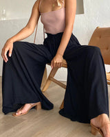 Pantalon taille haute de couleur unie