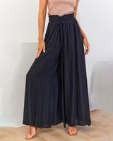 Pantalon taille haute de couleur unie