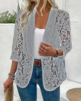 Manteau élégant à revers en dentelle florale de couleur unie
