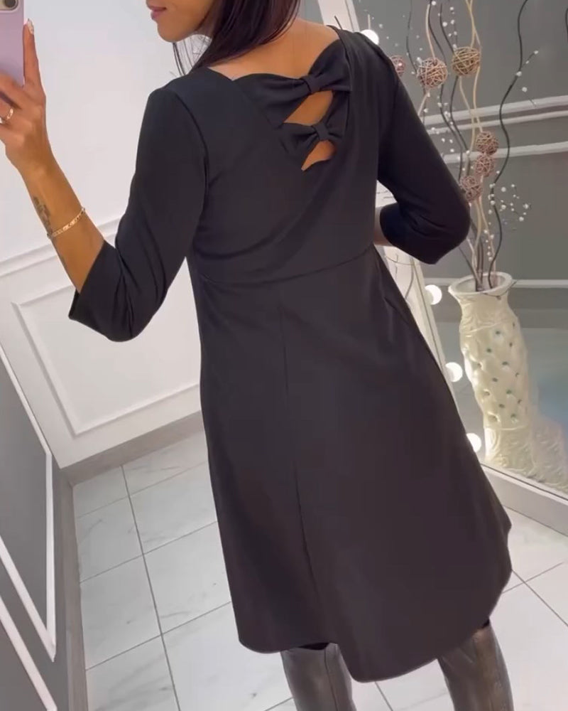 Robe unie avec nœud au dos