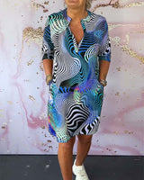 Robe à poches imprimée colorée avec col en V et demi-manches