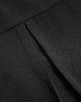 Haut décontracté à empiècements et boutons à sequins