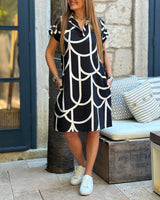 Robe midi imprimée à manches courtes et ligne de revers
