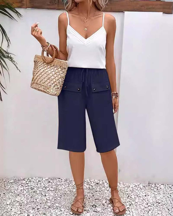 Pantalon mi-long décontracté avec poche de couleur unie