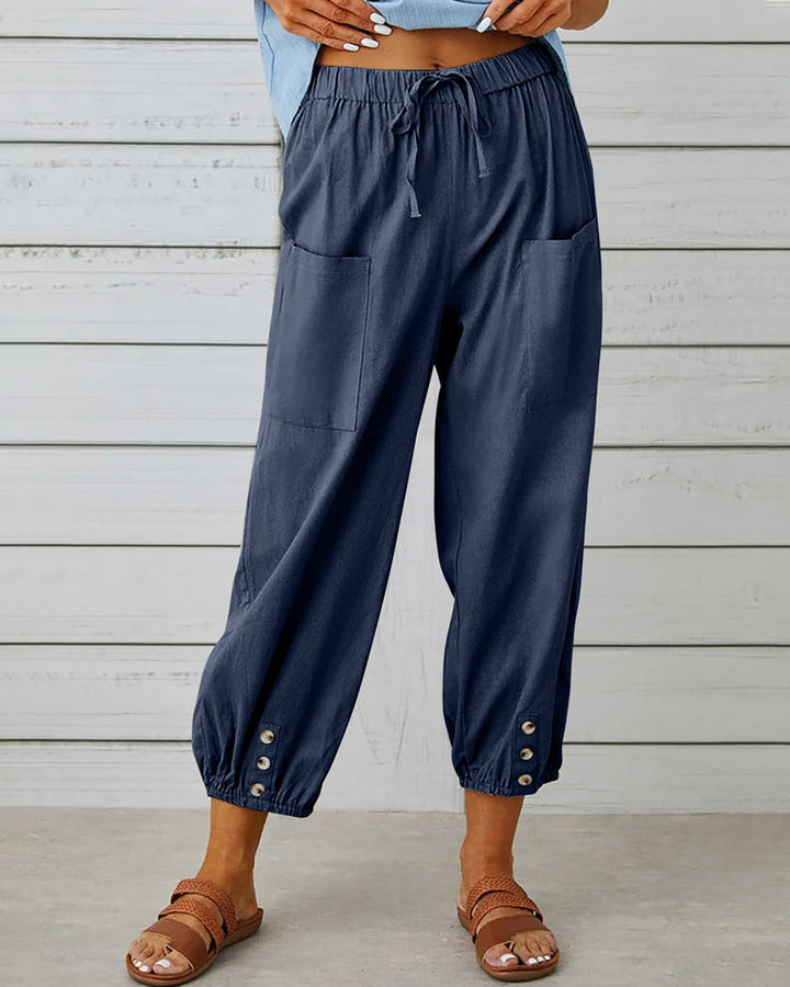 Pantalon taille haute bouton neuf points