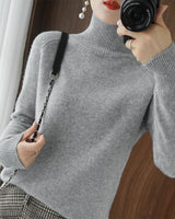 Pull simple à manches longues et col haut de couleur unie