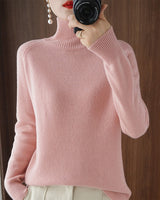 Pull simple à manches longues et col haut de couleur unie