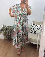 Robe élégante torsadée à col en V et imprimé botanique