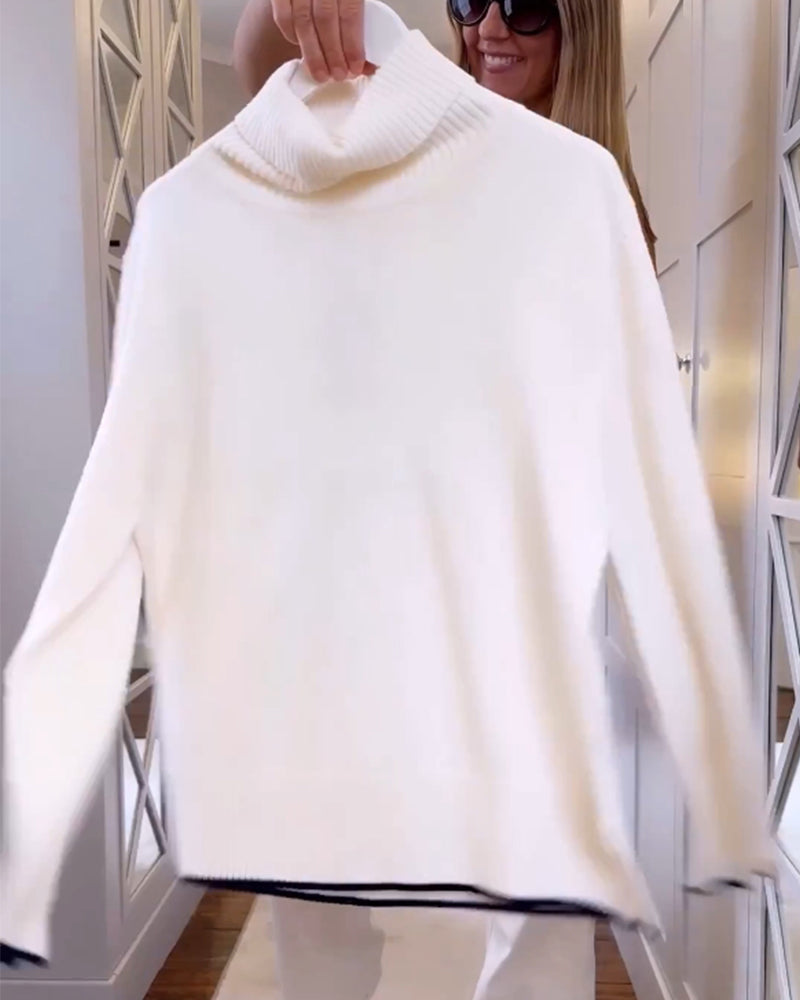 Pull avec le cou haut et les manches longues