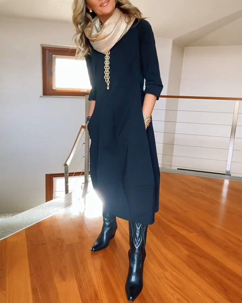 Robe élégante de couleur unie avec poche et col rond