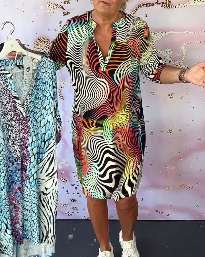 Robe à poches imprimée colorée avec col en V et demi-manches