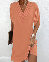 Robe élégante à manches fendues de couleur unie